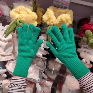 Detailed view of winter knitted gloves showcasing warm wool texture and comfortable fit.