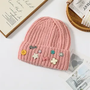 Pink knitted beanie hat for women, thick warm winter slouchy cap with cute decorative pins.