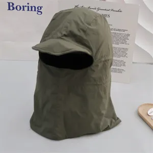 Detail of windproof waterproof outdoor cycling warm balaclava hat with short brim in green.