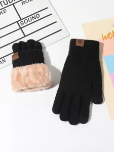 Detail shot of winter warm thick knit gloves with fleece lining for cold weather riding protection.