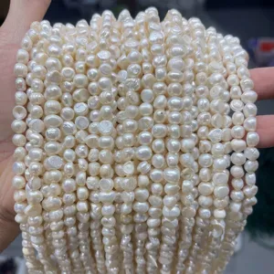 Detailed macro shot of natural white freshwater baroque pearl loose beads for jewelry making