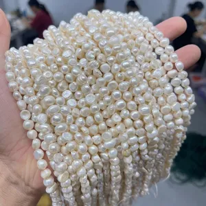 Close-up of natural white freshwater baroque pearls for DIY jewelry making.