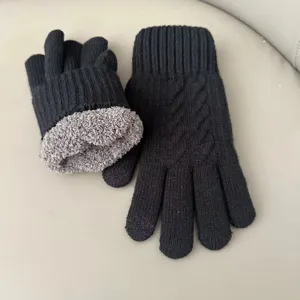 Winter warm black knitted gloves with thick grey fleece lining, cozy touch design.