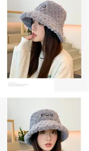 Women winter thick plush bucket hat detail shot, soft furry fabric, cozy warm grey fashion cap.