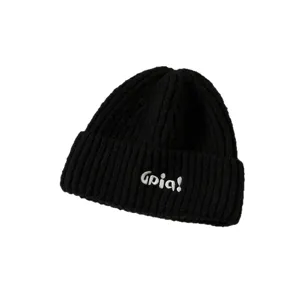 Close-up detail of black ribbed knit beanie with white embroidered Opia text design.