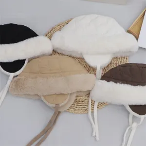 Winter plush ear-flap bucket hat with thick warm fleece lining for cold weather outdoor sports.