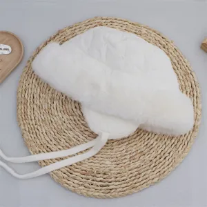White plush thickened winter fisherman hat with earflaps and windproof ties for cold days.