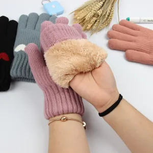 Detailed view of women's thermal knitted gloves featuring soft plush inner lining.