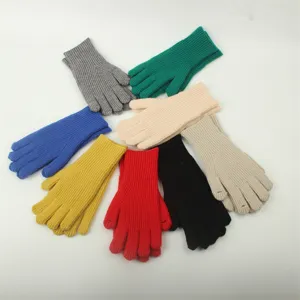 Detailed view of colorful knitted ribbed fingerless gloves, soft winter warm handwear display