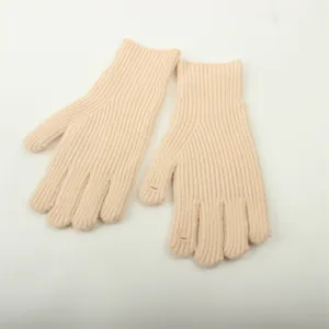Detailed view of women winter knit gloves, beige ribbed texture with unique finger opening design.