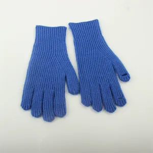 Detailed view of the blue knitted fingerless gloves showing ribbed texture and open-finger design.