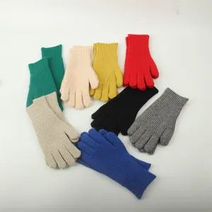 Colorful knit gloves detail showing multiple winter warm gloves in various vibrant solid colors.