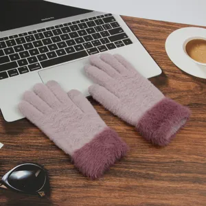 Winter warm touch screen knitted gloves for women with cozy plush cuffs on desk detail