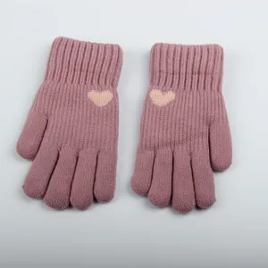 Women's thick knitted winter gloves detail view, cozy fleece lined warm winter accessories.