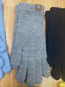 Women winter warm knitted touch screen gloves detail view, featuring cozy ribbed texture.