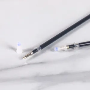 Close-up detail shot of disappearing ink pen refills with clear tips and protective caps.