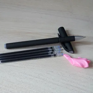 Detail view of black vanishing ink pen set with four refills and cute pink silicone grip.