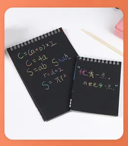 Close-up of rainbow scratch art notebooks showing colorful mathematical formulas