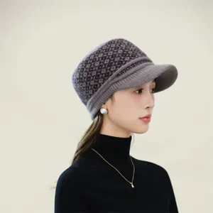 Detail view of the winter knitted visor hat with cozy geometric pattern and velvet lining.