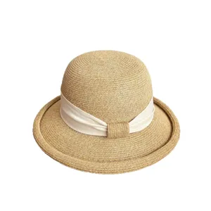 Women's French straw sun hat with white ribbon bow and rolled brim for summer outdoor wear.
