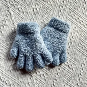 Detail shot of kids winter warm fleece-lined knitted gloves in solid light blue color.