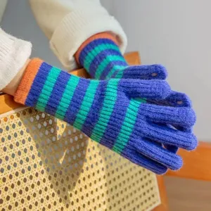 Warm winter knitted gloves for women, long striped touch screen open finger design detail.