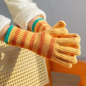 Cozy striped knit gloves for women, vibrant color-block long tube design, warm winter fashion.