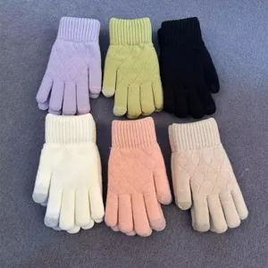 Detailed view of women winter knitted gloves in multi-color solid styles with diamond pattern.