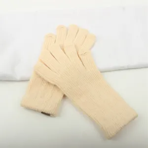 Detailed view of beige knitted touchscreen gloves for women, featuring extended wrist and finger holes.