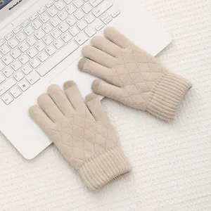 Women winter warm knit touchscreen gloves detail view, thick wool diamond pattern knitwear.