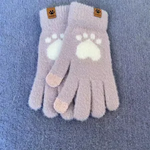 Detailed view of fluffy knit touch screen winter gloves with cute paw pattern, soft fabric.