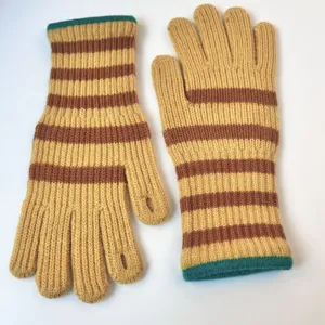 Detailed view of warm knitted striped winter gloves featuring finger openings and soft texture.