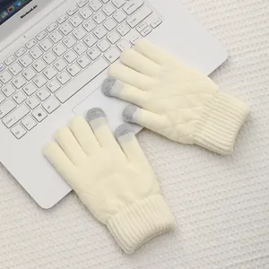 Detail shot of winter warm knitted touch screen gloves in creamy white with diamond pattern.