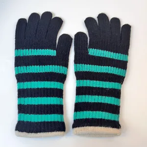 Detailed view of women's long knitted five-finger gloves featuring black and turquoise stripes.