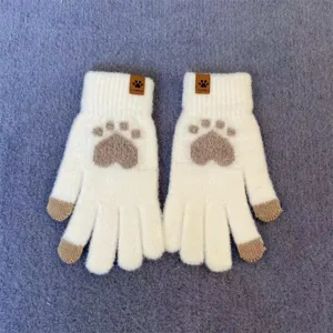 Detailed view of women's warm winter knit touchscreen gloves featuring cute cat paw prints.