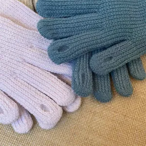 Close-up of women winter warm solid color fingerless knit gloves, soft wool texture detail.