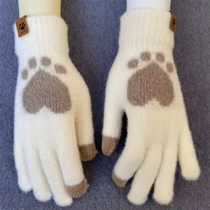Close-up detail of cute cat paw knit touchscreen gloves in white, cozy and thick winter wear.
