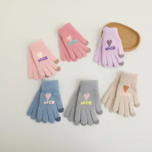 Women winter warm knitted touch screen gloves featuring cute heart and nice knit pattern.