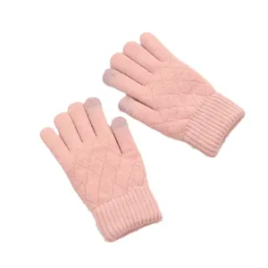 Detail view of pink knitted touch screen gloves with diamond pattern and ribbed cuffs.