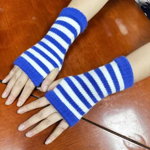 Close-up details of blue and white striped knit fingerless gloves, cozy arm warmers.