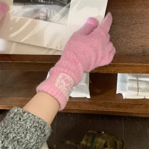 Cozy pink knit touchscreen gloves with delicate lace wrist detail for autumn and winter warmth.