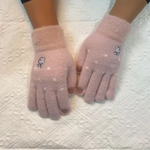 Detail shot of cute rabbit embroidered pink knit gloves with touch screen fingertips for women.