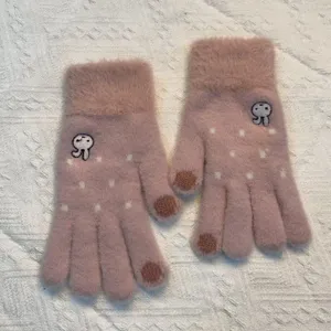 Detailed view of women's cute embroidered bunny knit winter gloves in soft pink fluffy material.