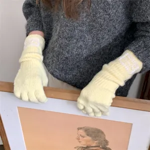 Yellow knit split finger gloves featuring delicate white lace embroidery decorative patches.