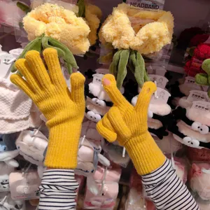 Yellow knit touchscreen split-finger gloves for winter warmth and outdoor cycling wear.