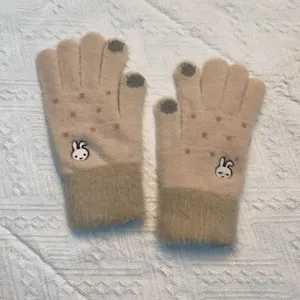 Detailed view of cute rabbit embroidered knit touch screen gloves with plush cuffs for winter.
