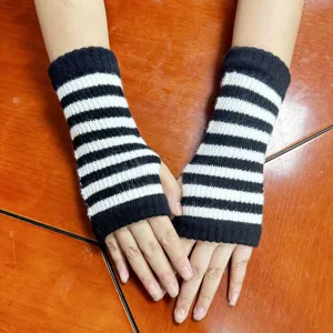 Black and white striped knit arm warmers, cozy winter fingerless gloves for women daily style.