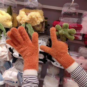 Warm winter knit split-finger gloves for women, cozy thermal fuzzy touchscreen gloves orange.