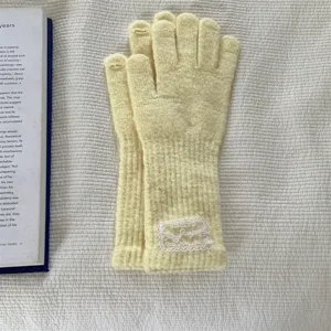 Long yellow knit gloves with lace label detail, warm winter five-finger thermal gloves.