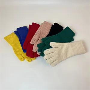 Detailed view of colorful winter knitted gloves with split fingers for women, warm and cozy.